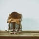 Hoarding Your Past - Man sitting with head in hands and knee's remembering bad times.